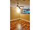 Inviting living room featuring wood flooring, a ceiling fan and a floor lamp at 1873 Mazo Mnr # T5, Lutz, FL 33558