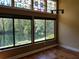 Bright living room featuring laminate wood flooring, large windows and water views at 1873 Mazo Mnr # T5, Lutz, FL 33558