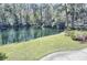 Enjoy the serene pond view with lush green landscaping at 1873 Mazo Mnr # T5, Lutz, FL 33558