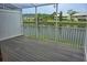 Relax on the screened porch with a view of the serene lake at 1873 Mazo Mnr # T5, Lutz, FL 33558