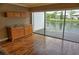 Bright sun room featuring a bar area and a screened in porch overlooking the water at 1873 Mazo Mnr # T5, Lutz, FL 33558