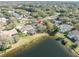Aerial perspective of a house by a lake at 4486 Berisford Blvd, Palm Harbor, FL 34685