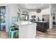 Modern kitchen with a large island and bright teal accents at 4486 Berisford Blvd, Palm Harbor, FL 34685
