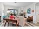 Cozy living room with a fireplace, comfortable seating, and a view of the backyard at 4486 Berisford Blvd, Palm Harbor, FL 34685