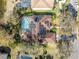 House with solar panels and pool, seen from above at 4486 Berisford Blvd, Palm Harbor, FL 34685