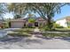 Attractive home exterior with solar panels and landscaping at 4486 Berisford Blvd, Palm Harbor, FL 34685