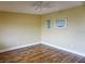 Bright bedroom with wood floors and neutral walls at 1873 Mazo Mnr # T5, Lutz, FL 33558