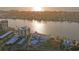 Breathtaking aerial view of waterfront buildings and the waterway, highlighted by the radiant hues of the sunset at 770 Island Way # N302, Clearwater, FL 33767