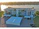 Aerial view of the condo building featuring carport parking, with water views at 770 Island Way # N302, Clearwater, FL 33767