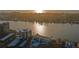 Breathtaking aerial view of waterfront buildings and the waterway, highlighted by the radiant hues of the sunset at 770 Island Way # N302, Clearwater, FL 33767