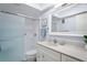 Modern bathroom with sleek vanity, glass shower, and contemporary fixtures at 770 Island Way # N302, Clearwater, FL 33767