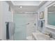 Bathroom featuring a glass shower, toilet, vanity with sink and a modern color palette at 770 Island Way # N302, Clearwater, FL 33767