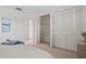 Bright bedroom with ample closet space and neutral decor at 770 Island Way # N302, Clearwater, FL 33767