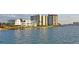 Beautiful waterfront property showcasing lush landscaping and waterfront access and resort-style living at 770 Island Way # N302, Clearwater, FL 33767