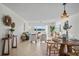 Bright living room with waterfront views, comfortable seating and a cozy dining area at 770 Island Way # N302, Clearwater, FL 33767
