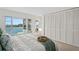 Serene main bedroom featuring a waterfront view and spacious closet at 770 Island Way # N302, Clearwater, FL 33767