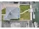 Aerial view of the home's backyard showing a maintained lawn, dock, and patio set on the canal at 13753 Judy Ave, Hudson, FL 34667