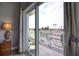 Scenic balcony with views of the canal and neighborhood, accessible through sliding glass doors from the bedroom at 13753 Judy Ave, Hudson, FL 34667