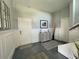 Modern entryway with gray tones, geometric rugs, and built-in shelving at 13753 Judy Ave, Hudson, FL 34667