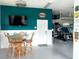 Finished garage with teal accent wall, entertainment area and ample storage space at 13753 Judy Ave, Hudson, FL 34667