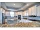 Beautiful kitchen with granite countertops, stainless steel appliances, and custom cabinets at 13753 Judy Ave, Hudson, FL 34667