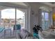 Cozy living room that offers scenic water views and sliding glass doors to a balcony at 13753 Judy Ave, Hudson, FL 34667