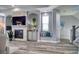 Cozy living room featuring a fireplace, built-in shelving, and ample seating at 13753 Judy Ave, Hudson, FL 34667