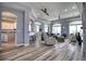 Spacious living room with a large window, hard wood floors, and modern furnishings at 13753 Judy Ave, Hudson, FL 34667