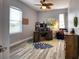Comfortable home office with a wooden desk, and a comfortable blue accent chair, offering a productive workspace at 13753 Judy Ave, Hudson, FL 34667