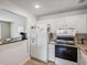 White kitchen with refrigerator and stove at 11935 Bayonet Ln # 0, New Port Richey, FL 34654