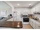 Kitchen with white cabinets and wooden countertops at 11935 Bayonet Ln # 0, New Port Richey, FL 34654