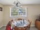 Dining room with table and view to backyard at 11935 Bayonet Ln # 0, New Port Richey, FL 34654