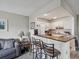 Kitchen with breakfast bar and white cabinets at 11935 Bayonet Ln # 0, New Port Richey, FL 34654