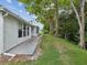 Landscaped backyard with mature trees at 11935 Bayonet Ln # 0, New Port Richey, FL 34654