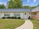 Front view of light green condo building at 11935 Bayonet Ln # 0, New Port Richey, FL 34654