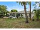 View of the house from the backyard, showing landscaping at 2503 Westchester Blvd, Spring Hill, FL 34606