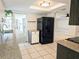 Kitchen boasts black appliances and granite countertops at 9137 Saint Clair Ln, Port Richey, FL 34668