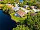 An aerial view showcases a home with a pool on a lush, waterfront lot at 21312 Preservation Dr, Land O Lakes, FL 34638