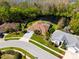 Aerial view of a home with a private pool, landscaping and lake access at 21312 Preservation Dr, Land O Lakes, FL 34638
