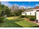 Well-maintained lawn with lush landscaping and a view of the home's exterior at 21312 Preservation Dr, Land O Lakes, FL 34638