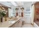 Well-lit bathroom with a large mirror, vanity, and decorative floral accents at 21312 Preservation Dr, Land O Lakes, FL 34638