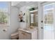 Bathroom features a vanity, mirror, and a view of the pool outside at 21312 Preservation Dr, Land O Lakes, FL 34638