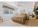 Comfortable bedroom with natural light, neutral décor, and space for relaxation at 21312 Preservation Dr, Land O Lakes, FL 34638