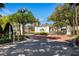 Gated entrance to a community with brick-paved road and well-maintained landscaping at 21312 Preservation Dr, Land O Lakes, FL 34638