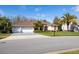 Charming single-story home with a three-car garage and well-maintained landscaping at 21312 Preservation Dr, Land O Lakes, FL 34638