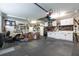 Spacious garage is equipped with storage cabinets and contains a utility vehicle at 21312 Preservation Dr, Land O Lakes, FL 34638