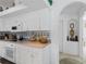 Bright kitchen with white cabinets, light countertops, tile backsplash, and modern appliances at 21312 Preservation Dr, Land O Lakes, FL 34638