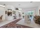 Bright living room featuring a view of the pool and outdoor patio, with elegant decor and comfortable seating at 21312 Preservation Dr, Land O Lakes, FL 34638