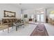 Open living room with a chandelier, with views to the foyer and dining room at 21312 Preservation Dr, Land O Lakes, FL 34638