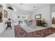 Spacious living room with neutral tones, elegant furniture, and sliding glass doors leading to the outdoor area at 21312 Preservation Dr, Land O Lakes, FL 34638